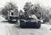 A Stug III self-propelled gun moving past a tram in Oosterbeek