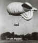 A balloon rises with a group of trainee jumpers in its cage