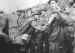 Captured paratroopers being searched by a German soldier