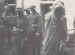 British prisoners being led away as German troops look on