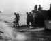 Troops disembark from a Landing Craft