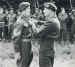 Lance-Sergeant Mayhew receiving his Military Medal from Field Marshal Montgomery on the 1st September 1944