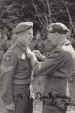 Sergeant Minard receives his Military Medal from Field Marshal Montgomery