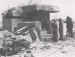 Men of the 50th (Northumbrian) Division inspecting a wrecked artillery emplacement on Gold Beach