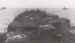 A ship crammed with transport vehicles on its way to Normandy