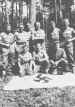 Men of the 249th Field Company pose with a captured Nazi flag near Caen
