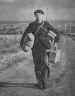 A former French Prisoner of War walks home with his possessions
