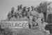 British troops posing next to a "Stalag 69" sign in Italy