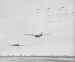 A C-47 lifts a Waco glider of the 17th Airborne Division into the air