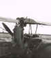 "Mac" McKinloy boarding a Tiger Moth