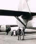 Sergeant Milton-Millar standing beside a MkII Horsa glider